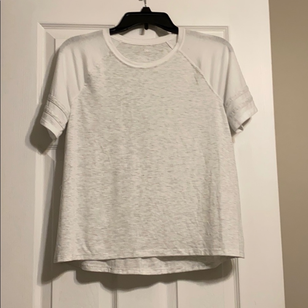 A grey and white short-sleeve see-through top